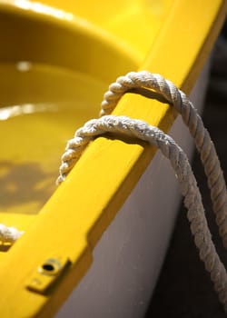Yellow boat with a rope close-up