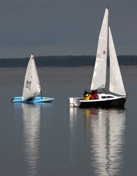 Two sailing boat at an open river. Russia