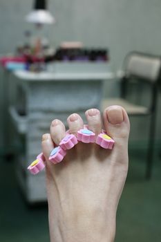 Barefooted female leg in a pedicure study