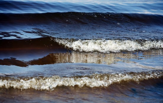 The image of dark blue water with waves