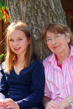 Family generations - portrait of granddaugher and grandmother