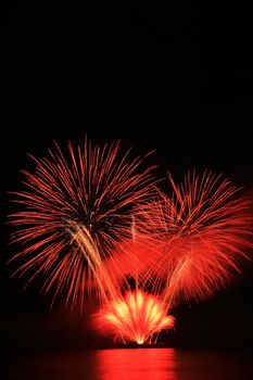 bright red fireworks against the dark sky
