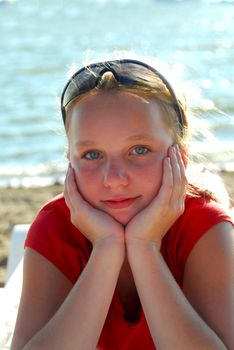 Portrait of a beautiful young girl on a beach