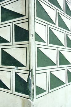 Architectural background. Closeup of old wall corner with rectangles decorations.