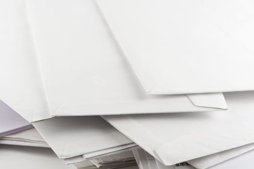 Stack of white envelopes , close up