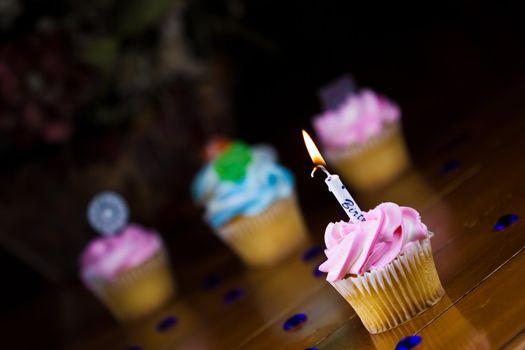 Close up of a cup cake on the wooden table