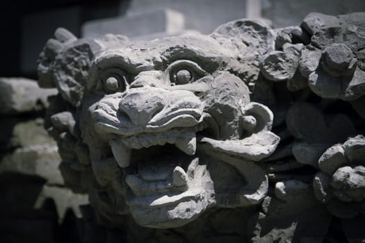 Traditional Balinese god statue in front of the temple