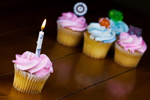 Close up of a cup cake on the wooden table