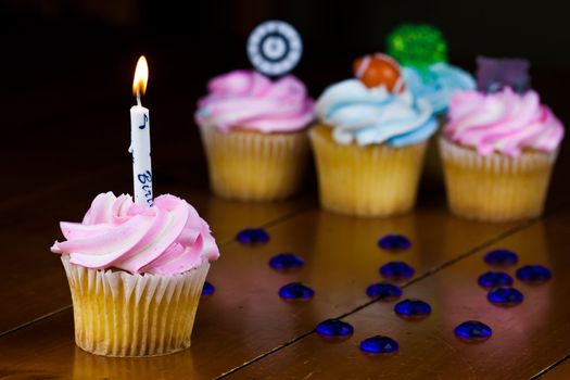 Close up of a cup cake on the wooden table