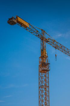 big yellow construction crane  on building site