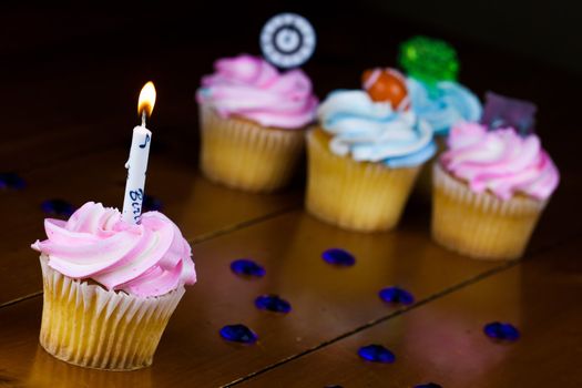 Close up of a cup cake on the wooden table