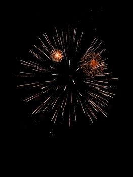 Photo of fireworks isolated on the dark sky