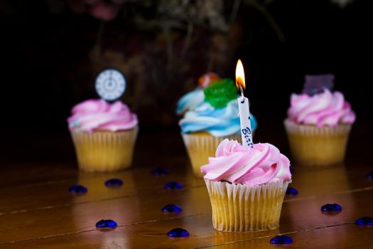 Close up of a cup cake on the wooden table