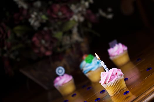 Close up of a cup cake on the wooden table