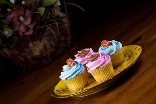 Close up of a cup cake on the wooden table