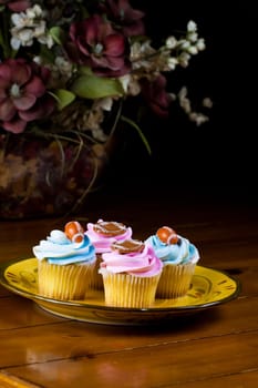 Close up of a cup cake on the wooden table