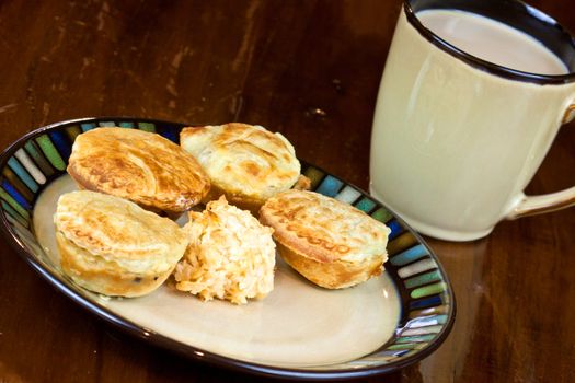 Mini cakes on a plate with a cup o coffee