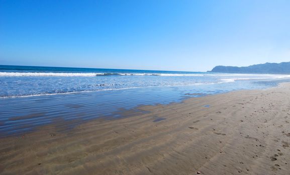 tropical beach with blue sky. travel holiday background