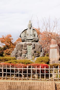 Stone monument in a Japanese autumn park 
