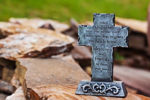 Close up decor of outdoors stone made cross