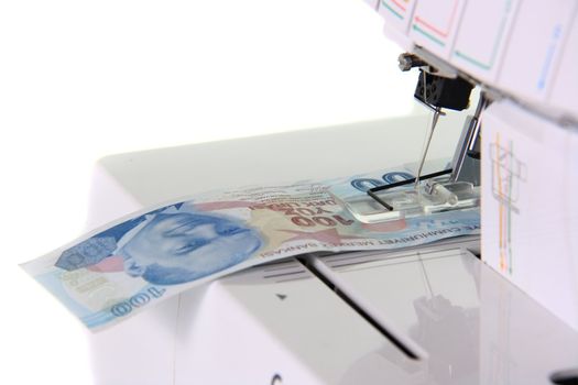 sewing machine sewing money turkish lira on white background