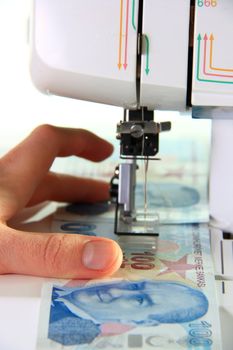 sewing machine sewing money turkish lira on white background
