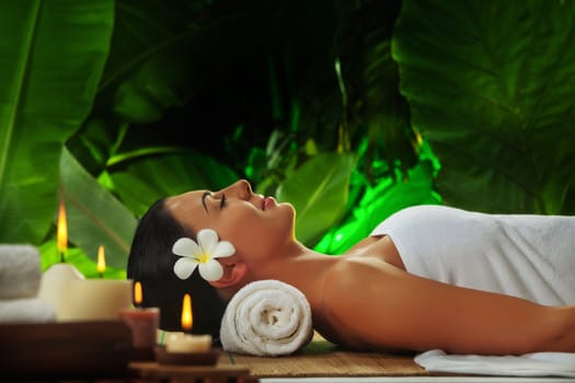 portrait of young beautiful woman in spa environment.