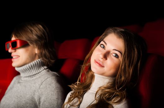 young couple in the cinema to enjoy the movie