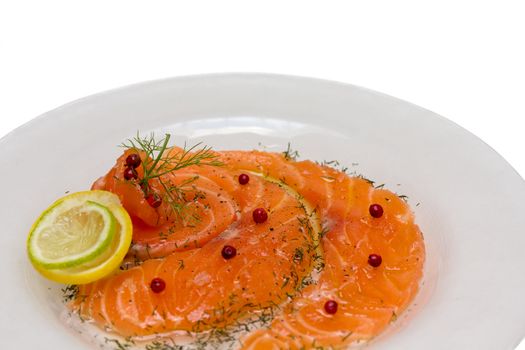 Salmon carpaccio with pink pepper and juice of lemons