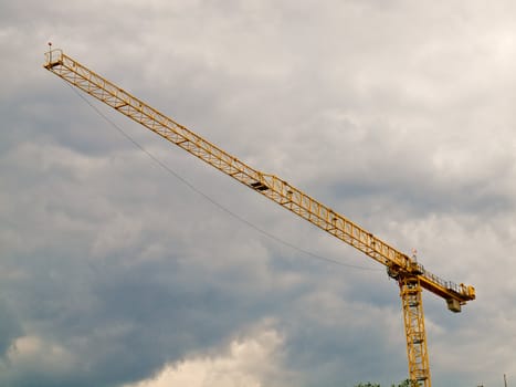 Large Construction Crane in Front of a Cloudy Sky