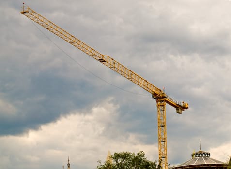 Large Construction Crane in Front of a Cloudy Sky