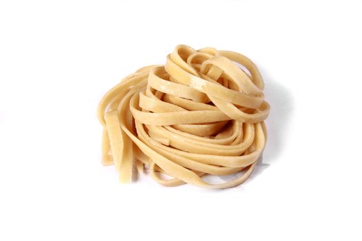 white bowl with boiled spaghetti on plate