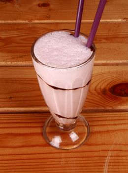 milkshake on wooden background for you .