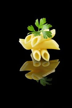 Italian pasta on black background