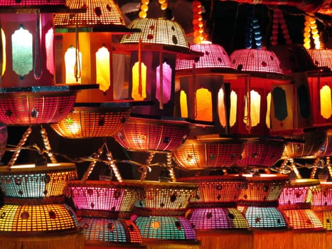 Traditional handmade Indian lanterns in beautiful colors for sale at a shop.                               