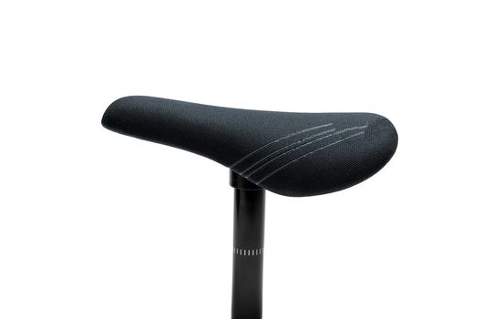 A saddle seat on a bicycle with a white isolated background.