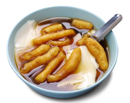 Bean junket eaten hot with gingered sirup and mini deep-fried dough stick