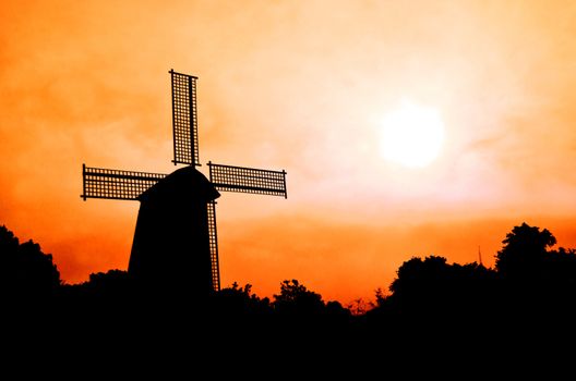 silhouette Wind generator on colorful sky