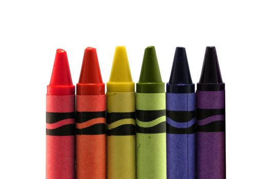 six used colored vax crayons form rainbow