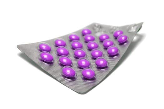a lot of medical pills on white background