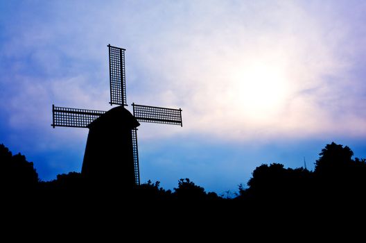 silhouette Wind generator on colorful sky