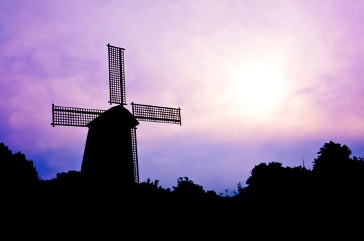 silhouette Wind generator on colorful sky