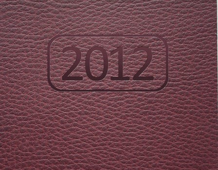 Year 2012 text on leather background