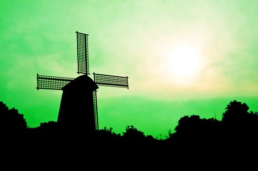 silhouette Wind generator on colorful sky