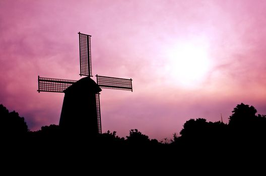 silhouette Wind generator on colorful sky