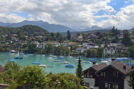 views of Lake Thun. boats against the backdrop of beautiful mountains