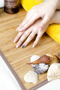 Spa hands over bamboo mat