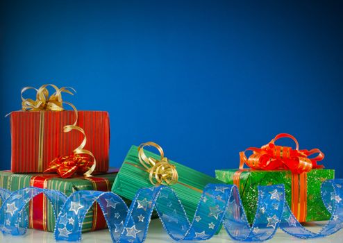 Christmas presents against blue background