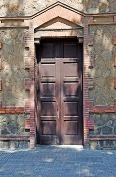 Aged residental door in Lloret de Mar, Spain.