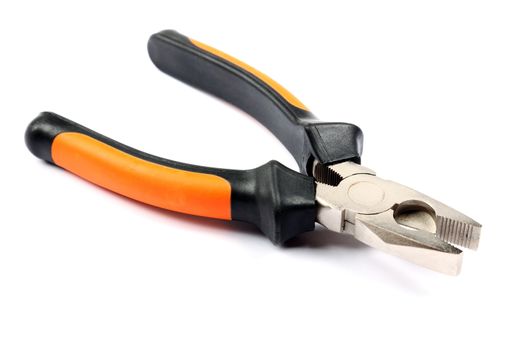 Studio shot of orange with black pliers isolated on white background.